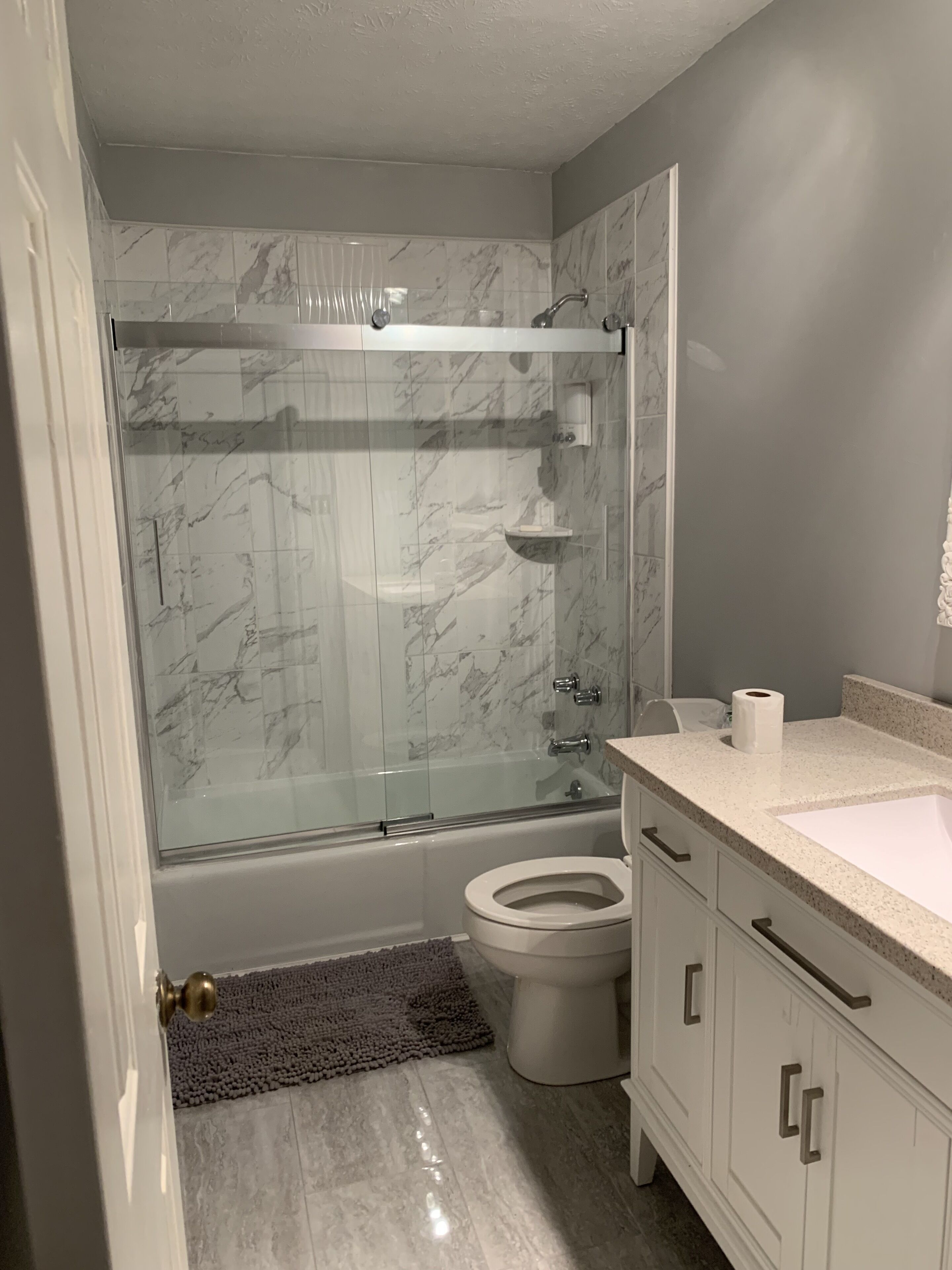 Combined shower/tub, hair dryer, towels, soap