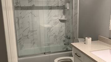 Combined shower/tub, hair dryer, towels, soap