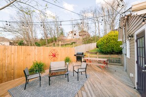 A wooden deck with outdoor furniture, a barbecue grill, and a wooden fence. - WALK EVERYWHERE in North Chat! -VIEWS- 2 KING Beds (Chattanooga)