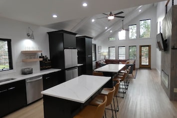 Open concept eat in kitchen and living area.