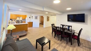 A modern apartment with a dining area, kitchen, and living room. - New 2 Bedroom Suite Fairfield Heritage Manor, Free Parking (Victoria)