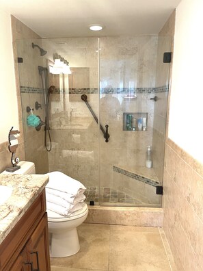 Shower, hair dryer, towels, soap