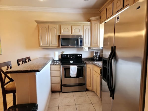 Condo, 2 Bedrooms | Private kitchen | Fridge, coffee/tea maker, cookware/dishes/utensils