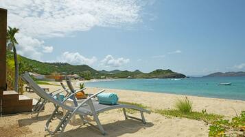 On the beach, sun-loungers