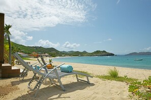 On the beach, sun-loungers