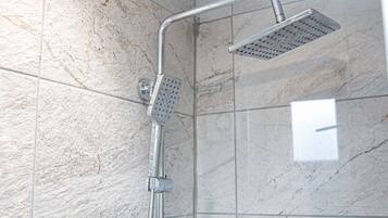 Apartment, 1 Bedroom, Hot Tub | Bathroom | Rainfall showerhead, bathrobes, slippers, towels