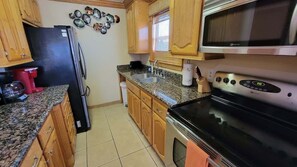 Condo, 2 Bedrooms | Private kitchen | Fridge, oven, coffee/tea maker, toaster