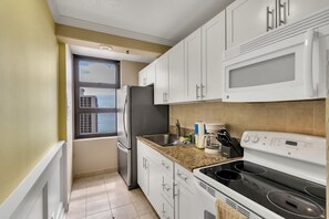 Condo, 1 Bedroom | Private kitchen | Fridge, microwave, oven, coffee/tea maker
