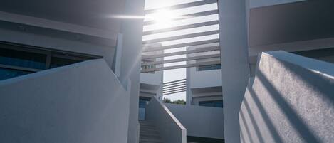 A modern building with a staircase leading to an upper level.