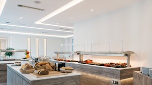 A modern kitchen with a central island, built-in appliances, and a clean, minimalist design. - Tesoro Hotel Zakynthos (Zakynthos)