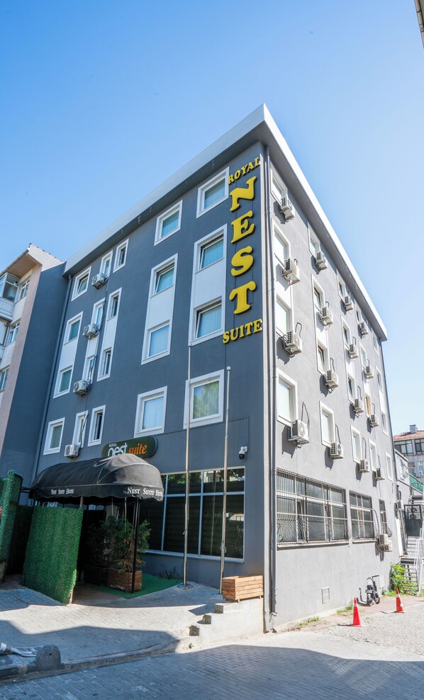 A hotel building with a sign reading "Royal Nest Suite Hotel". - Royal Nest (Istanbul)