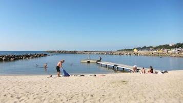 Guests can enjoy swimming and sunbathing on the sandy beach.