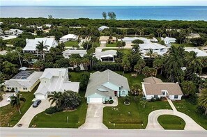 Stunning homes amidst lush greenery and ocean views.