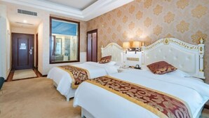 A hotel room with two beds, a large window, and a view of the outside. - Jingxi Global Hotel (Jingxi)
