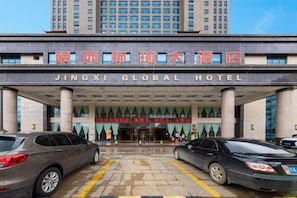 The entrance of Jingxi Global Hotel with a large sign in both Chinese and English.