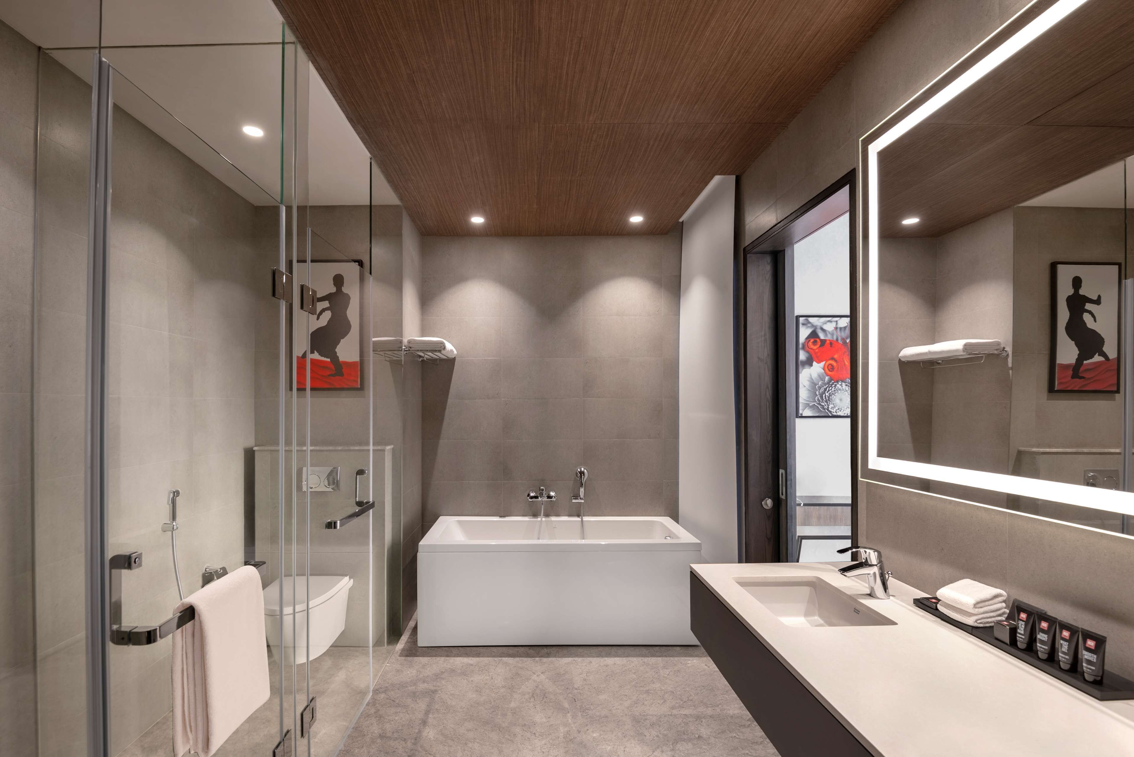 executive suite | bathroom | eco-friendly toiletries, hair dryer, bathrobes, slippers