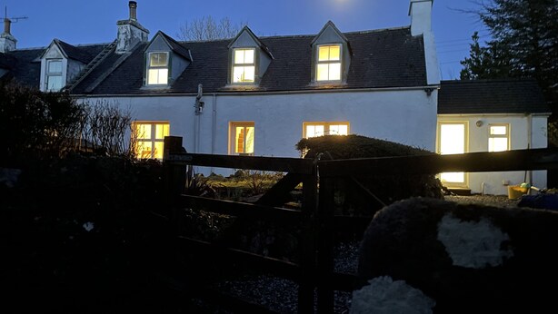 A traditional house with multiple windows and a visible chimney. - No 4 old Post Office Row, Isle of Skye (Skeabost)