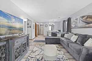 Signature Condo, 2 Bedrooms, Balcony | Living room | 55-inch Smart TV with cable channels, TV