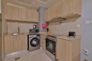 Apartment, City View | Private kitchen | Oven, stovetop, dishwasher, toaster - Stunning Studio near Downtown Dubai (Dubai)