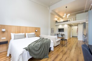 Loft | Premium bedding, down comforters, blackout drapes, iron/ironing board