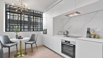 Apartment, 1 Bedroom | Living area | 32-inch flat-screen TV with digital channels, TV