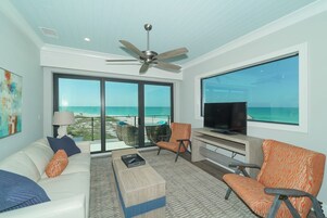 Oceanfront Luxury 1 Bedroom King Suite | Living area | Flat-screen TV