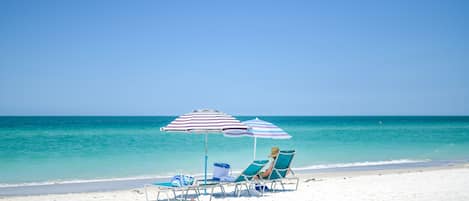 On the beach, white sand, beach towels