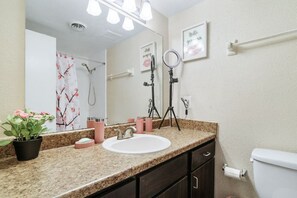 Combined shower/bathtub, hair dryer, towels, soap