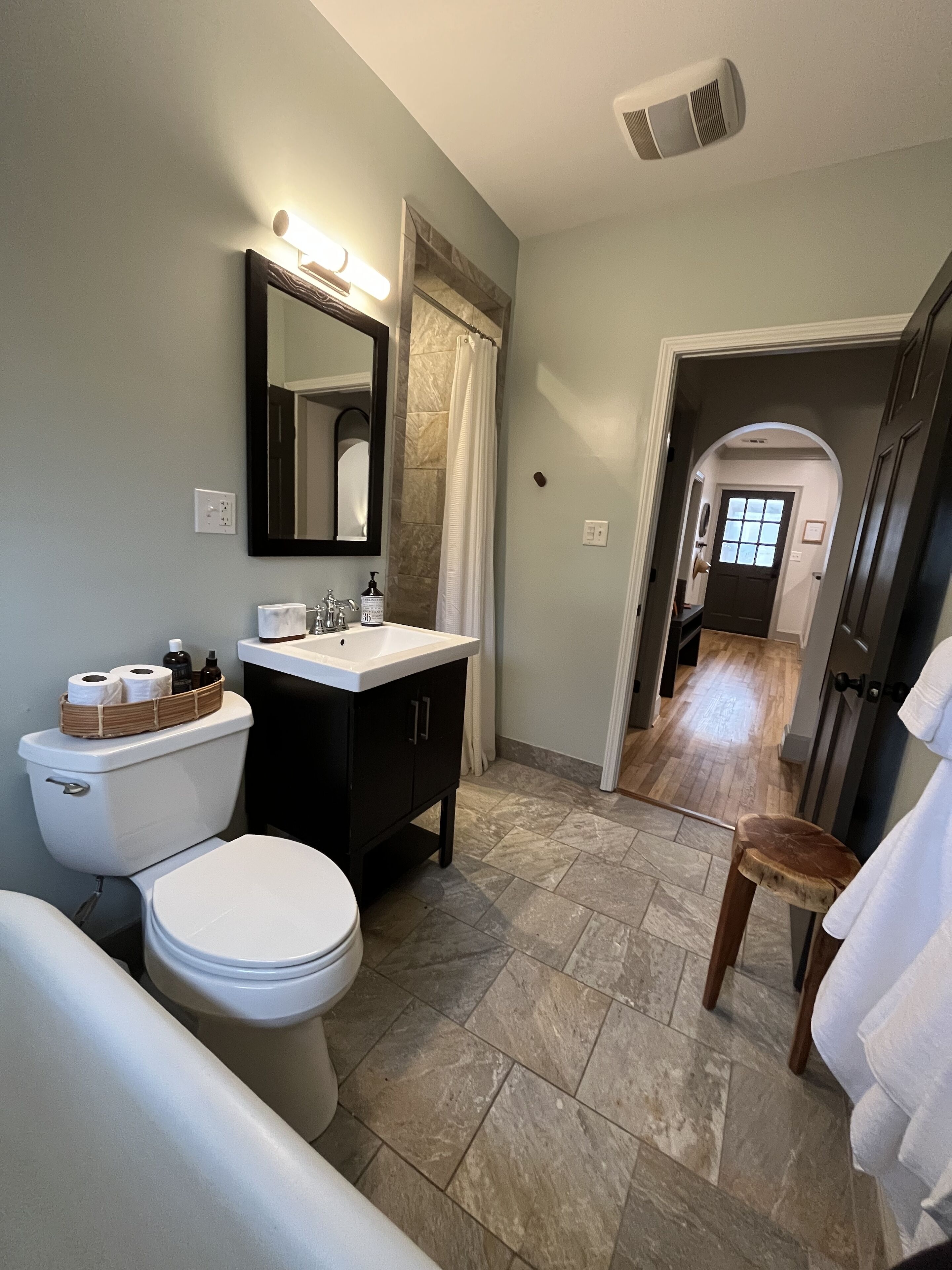 Bathtub, hair dryer, towels, soap