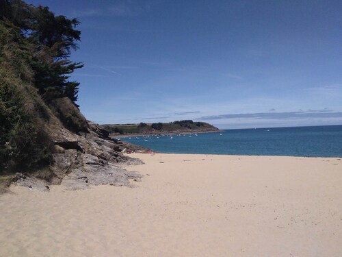 Large stone house in a green setting