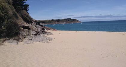 Large stone house in a green setting