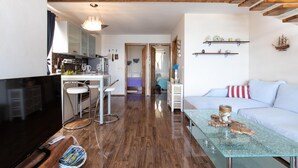A modern living space with a kitchen, dining area, and a cozy seating area. - 2 bedroom gorgeous apartment in Dobropoljana (Dobropoljana)