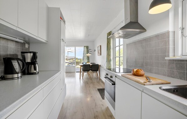 Fridge, stovetop, dishwasher, coffee/tea maker