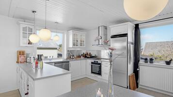 Fridge, stovetop, dishwasher, coffee/tea maker