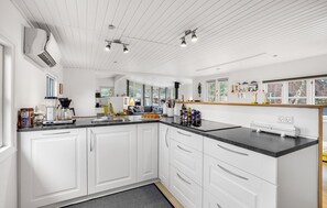 Fridge, stovetop, dishwasher, coffee/tea maker