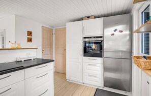 Fridge, stovetop, dishwasher, coffee/tea maker