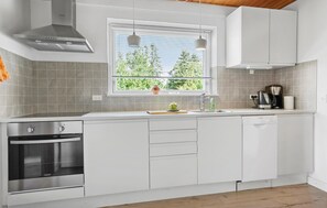 Fridge, stovetop, dishwasher, coffee/tea maker