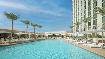 Outdoor pool, open 9:00 AM to 9:00 PM, cabanas (surcharge)