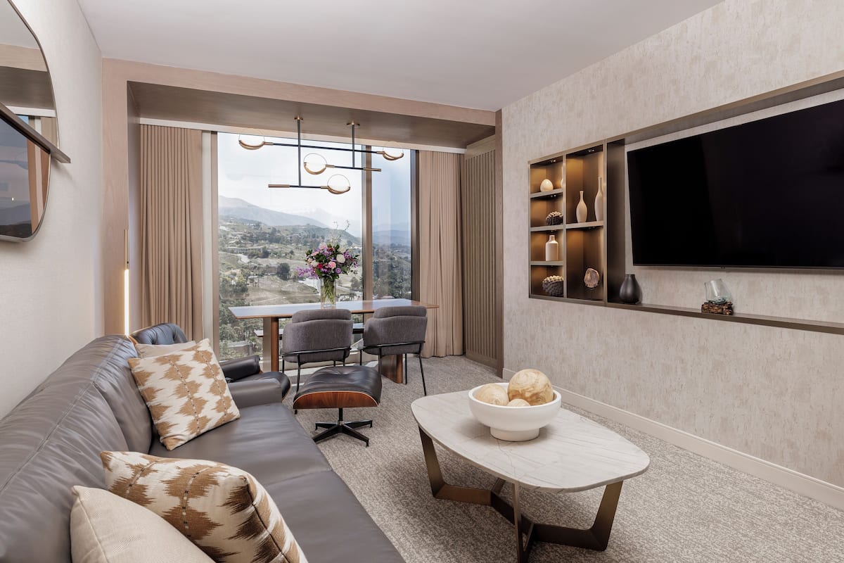 One Bedroom Suite | Living area | 55-inch LCD TV with cable channels, TV, Netflix