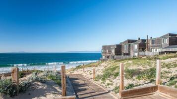 On the beach, sun loungers, beach towels