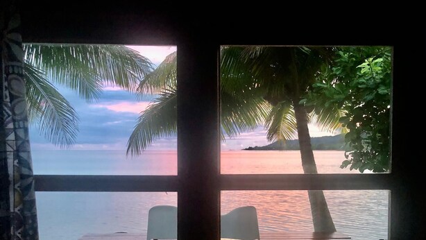 A room with a wooden deck, two chairs, and a small table. - Fare Vahine Oviri (Avera)