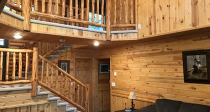 Log home nestled in tall pines near Norway Lake