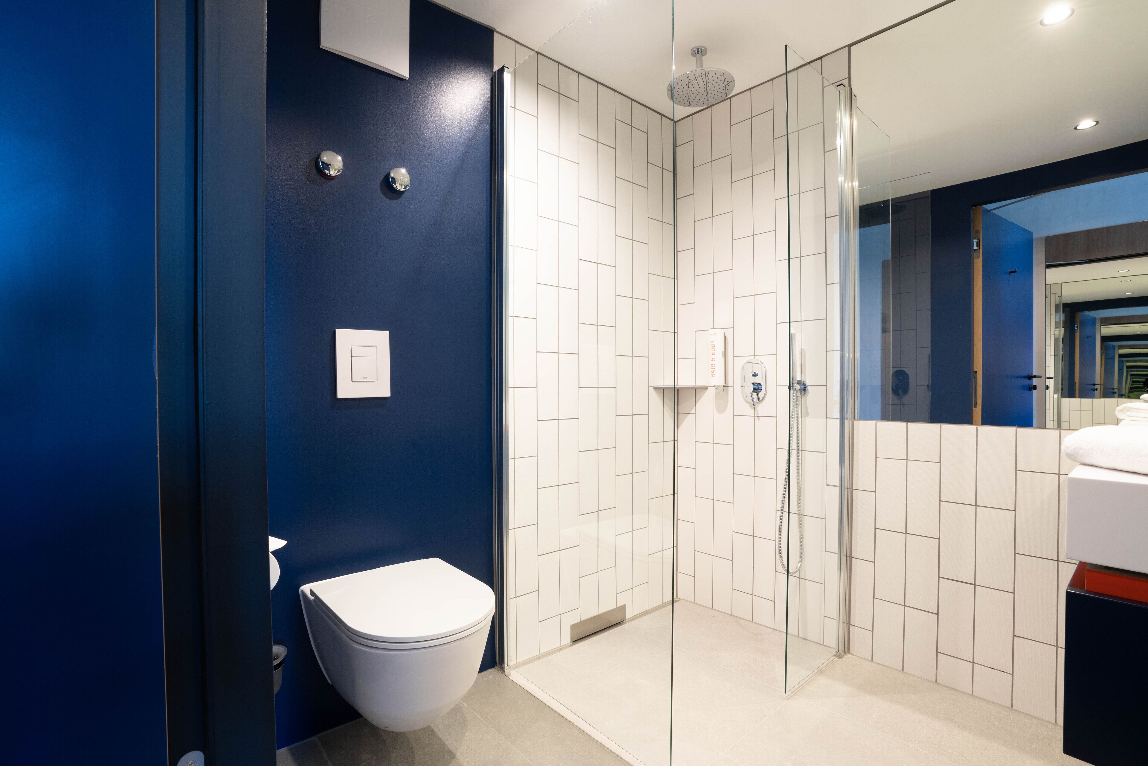 business studio | bathroom | shower, rainfall showerhead, hair dryer, towels