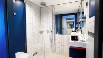 Shower, rainfall showerhead, hair dryer, towels