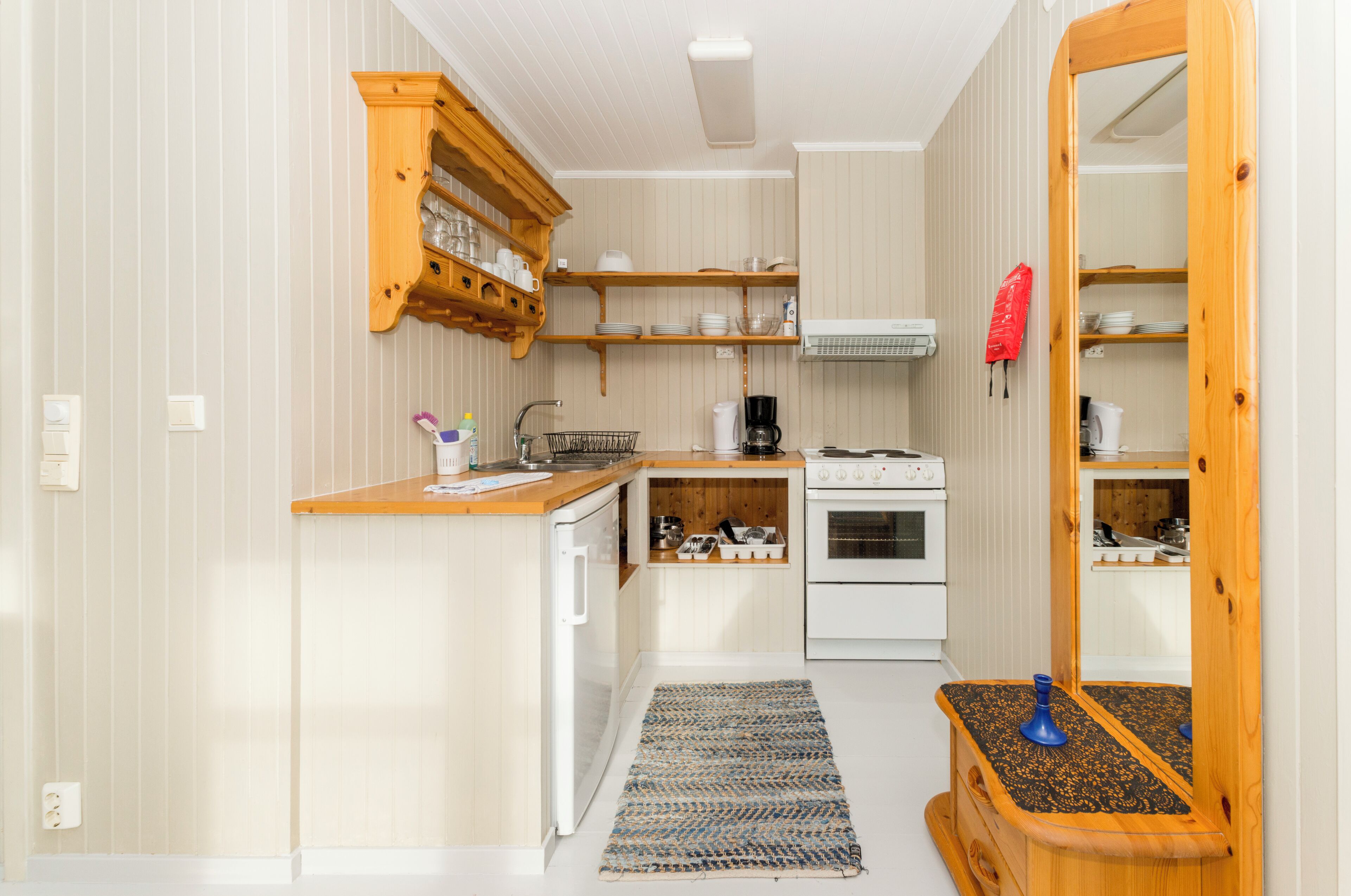 Departamento, 2 habitaciones | Cocina privada | Frigobar, horno, parrilla de estufa y cafetera y tetera 