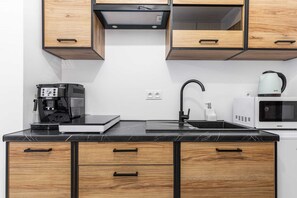 Fridge, microwave, stovetop, coffee/tea maker