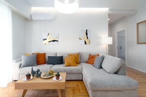 Deluxe Apartment | Living area | TV