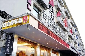 A building with signage for a business and a restaurant.