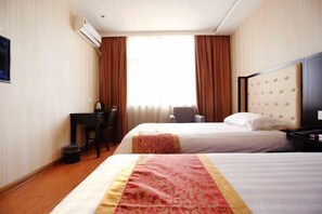 A hotel room with two beds, a desk, a chair, and an air conditioning unit. - Baishang Hotel‌ (Wenzhou)