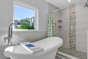 Bathtub, hair dryer, towels, soap